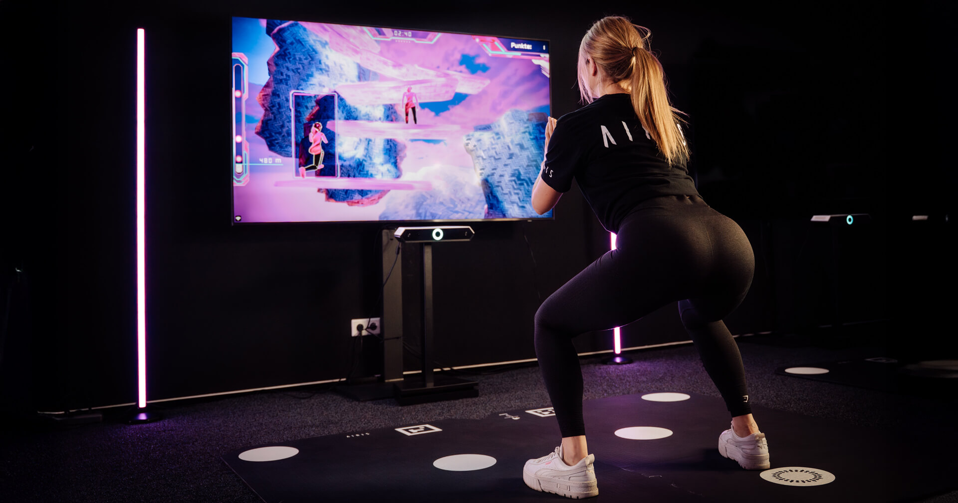 Frau beim BootyBurn-Workout von AIRIS